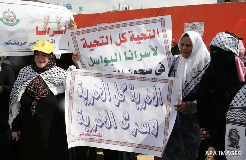 Palestinian women take part in a protest calling for the release of Palestinian prisoners from Israeli jails and in support of inmates in hunger strike on Oct 11, 2011 in Rafah, southern Gaza Strip. Hundreds of Palestini...