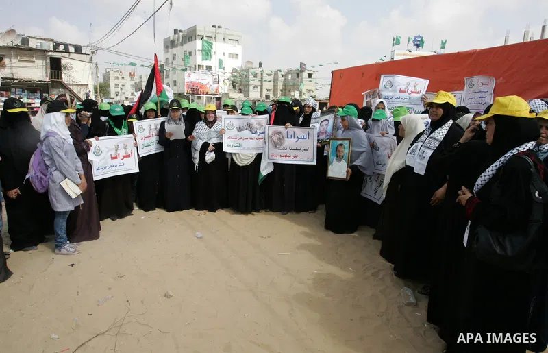 Palestinian women take part in a protest calling for the release of Palestinian prisoners from Israeli jails and in support of inmates in hunger strike on Oct 11, 2011 in Rafah, southern Gaza Strip. Hundreds of Palestini...