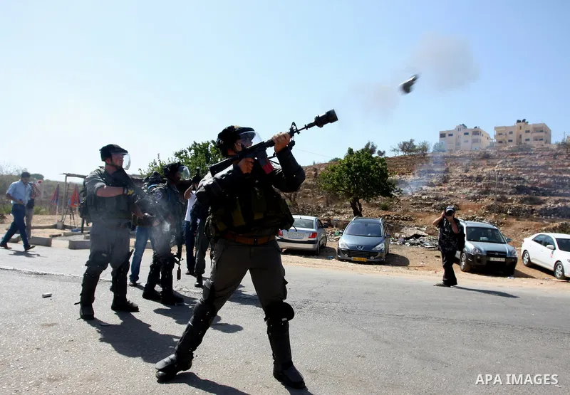 Israeli forces clash with Palestinian protestors following a demonstration calling for the release of prisoners held in Israeli jails and in support of inmates in hunger strike, on October 11, 2011 near Israel's Ofer pri...