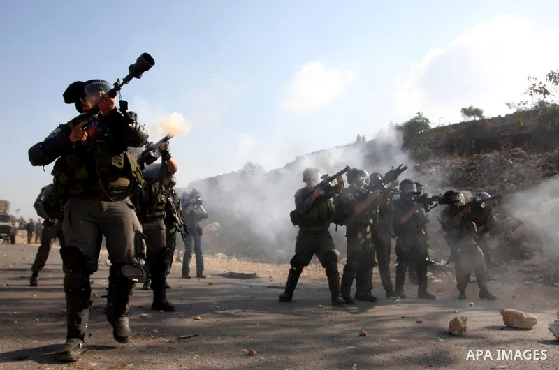 Israeli forces clash with Palestinian protestors following a demonstration calling for the release of prisoners held in Israeli jails and in support of inmates in hunger strike, on October 11, 2011 near Israel's Ofer pri...
