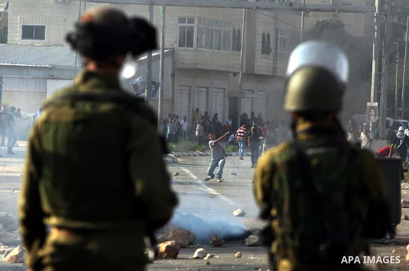 Israeli forces clash with Palestinian protestors following a demonstration calling for the release of prisoners held in Israeli jails and in support of inmates in hunger strike, on October 11, 2011 near Israel's Ofer pri...