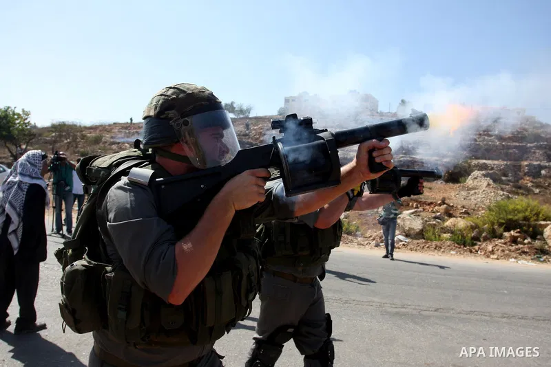 Israeli forces clash with Palestinian protestors following a demonstration calling for the release of prisoners held in Israeli jails and in support of inmates in hunger strike, on October 11, 2011 near Israel's Ofer pri...