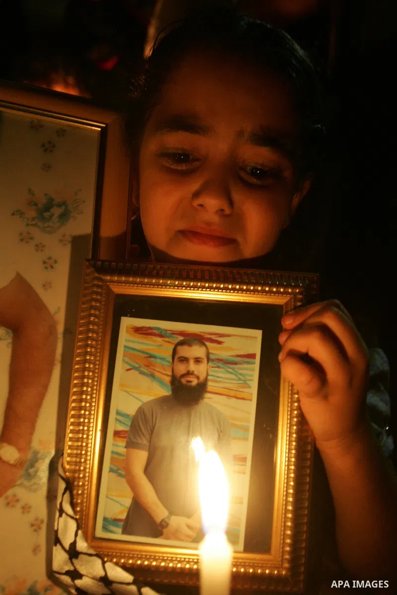 A Palestinian boy take part in a protest calling for the release of Palestinian prisoners from Israeli jails and in support of inmates in hunger strike on October 11, 2011 outside Damascus Gate in Jerusalem's Old City. A...