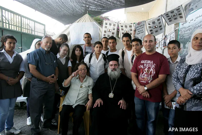 Palestinians take part in a protest calling for the release of Palestinian prisoners from Israeli jails and in support of inmates in hunger strike on October 11, 2011 outside the Red Cross buildings in Jerusalem's Old Ci...
