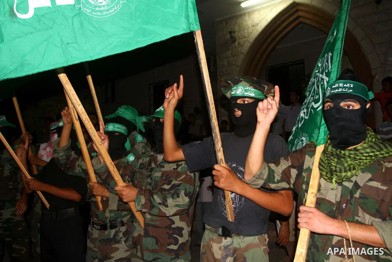 Palestinian members of Hamas celebrate a deal that will see Palestinian detainees freed in exchange for captured Israeli soldier Gilad Shalit on October 11, 2011, in Deir al-Balah in the central Gaza Strip. Shalit was ca...