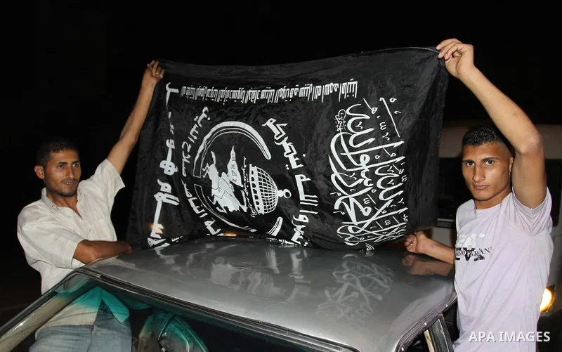 Palestinian members of Hamas celebrate a deal that will see Palestinian detainees freed in exchange for captured Israeli soldier Gilad Shalit on October 11, 2011, in Gaza City. Shalit was captured in 2006 by Hamas-allied...