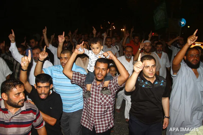 Palestinian members of Hamas celebrate a deal that will see Palestinian detainees freed in exchange for captured Israeli soldier Gilad Shalit on October 11, 2011, in Deir al-Balah in the central Gaza Strip. Shalit was ca...