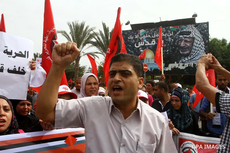 Palestinians celebrate a deal that will see Palestinian detainees freed in exchange for captured Israeli soldier Gilad Shalit on October 12, 2011 in Gaza City. Israel and Hamas have reached a deal that would see the rele...