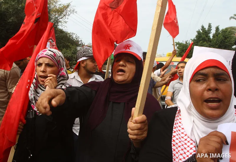 Palestinians celebrate a deal that will see Palestinian detainees freed in exchange for captured Israeli soldier Gilad Shalit on October 12, 2011 in Gaza City. Israel and Hamas have reached a deal that would see the rele...