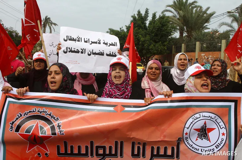 Palestinians celebrate a deal that will see Palestinian detainees freed in exchange for captured Israeli soldier Gilad Shalit on October 12, 2011 in Gaza City. Israel and Hamas have reached a deal that would see the rele...