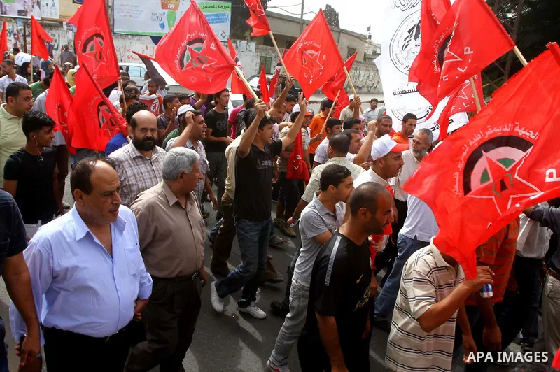 Palestinians celebrate a deal that will see Palestinian detainees freed in exchange for captured Israeli soldier Gilad Shalit on October 12, 2011 in Gaza City. Israel and Hamas have reached a deal that would see the rele...