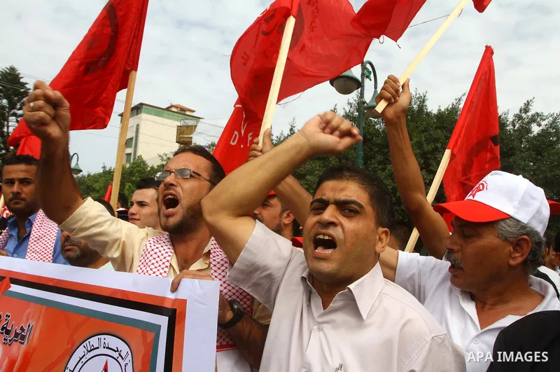 Palestinians celebrate a deal that will see Palestinian detainees freed in exchange for captured Israeli soldier Gilad Shalit on October 12, 2011 in Gaza City. Israel and Hamas have reached a deal that would see the rele...