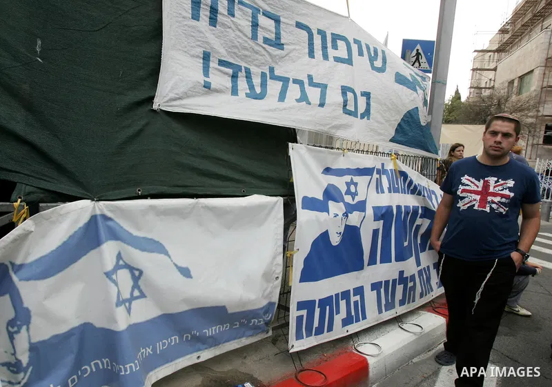 Friends and supporters of Noam and Aviva Shalit, parents of abducted Israeli soldier Gilad Shalit who was captured in 2006 by Hamas-allied militants in the Gaza Strip, gather at the family's protest tent on the 1,935th d...