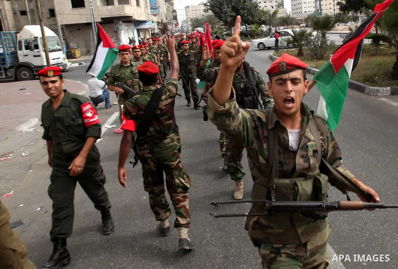 Members of Hamas national security forces Ca street as they celebrate a prisoner swap between Hamas and Israel, in Gaza City October 12, 2011. Prospects of a long-elusive deal with Hamas to secure the release of Israeli...