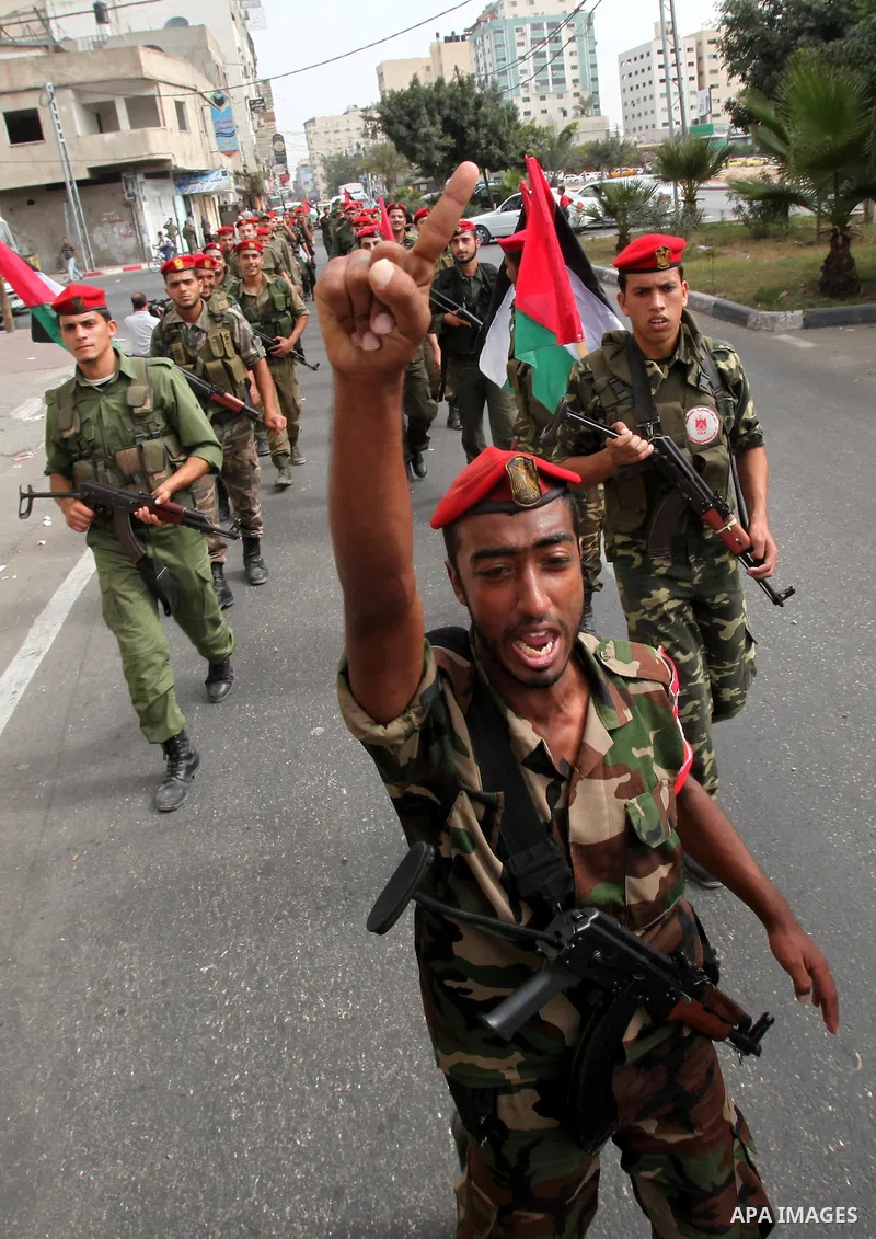 Members of Hamas national security forces Ca street as they celebrate a prisoner swap between Hamas and Israel, in Gaza City October 12, 2011. Prospects of a long-elusive deal with Hamas to secure the release of Israeli...
