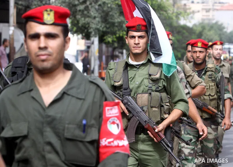 Members of Hamas national security forces Ca street as they celebrate a prisoner swap between Hamas and Israel, in Gaza City October 12, 2011. Prospects of a long-elusive deal with Hamas to secure the release of Israeli...