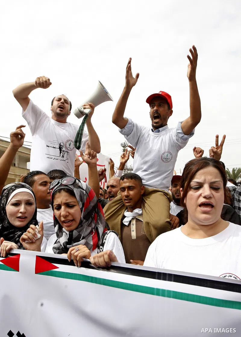 Palestinians chant slogans as they take part in a rally celebrating a prisoner swap between Hamas and Israel, in Gaza City October 12, 2011. Israelis welcomed on Wednesday a major prisoner swap that will free soldier Gil...