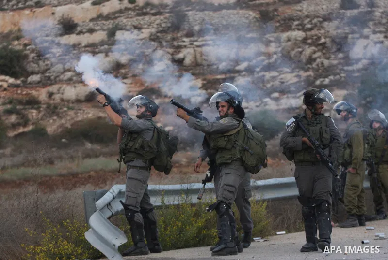 Israeli forces clash with Palestinian protestors following a demonstration calling for the release of prisoners held in Israeli jails and in support of inmates in hunger strike, on October 12, 2011 near Israel?s Ofer pri...
