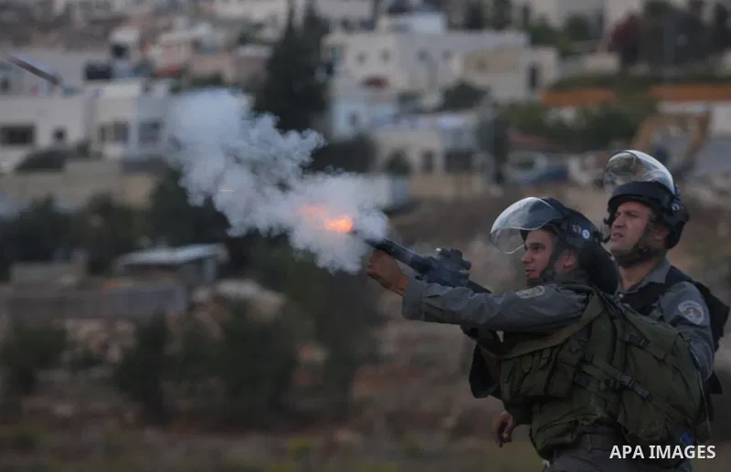 Israeli forces clash with Palestinian protestors following a demonstration calling for the release of prisoners held in Israeli jails and in support of inmates in hunger strike, on October 12, 2011 near Israel?s Ofer pri...