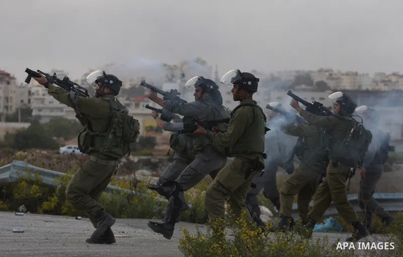 Israeli forces clash with Palestinian protestors following a demonstration calling for the release of prisoners held in Israeli jails and in support of inmates in hunger strike, on October 12, 2011 near Israel?s Ofer pri...
