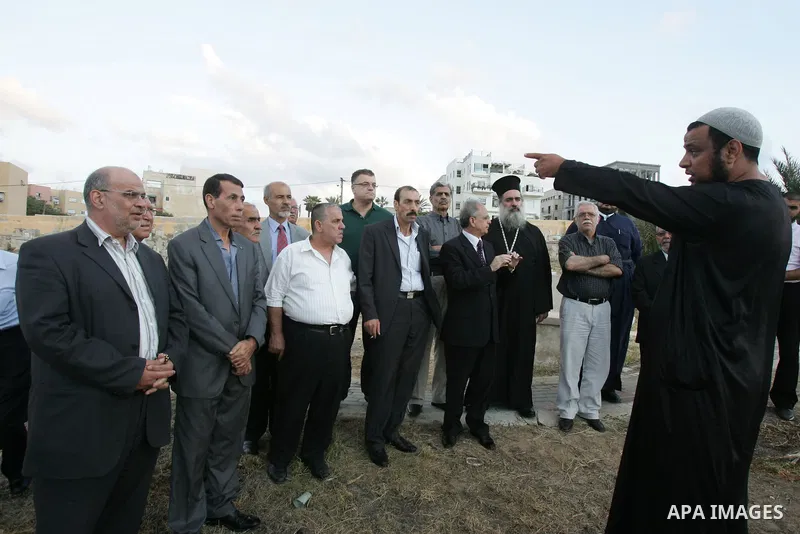 Palestinians inspect the destruction in the graves in the city of Jerusalem on August 6,2010. New plan for the Jerusalem municipality to remove the cemetery of Mamun Allah in West Jerusalem as the graves that marked in r...