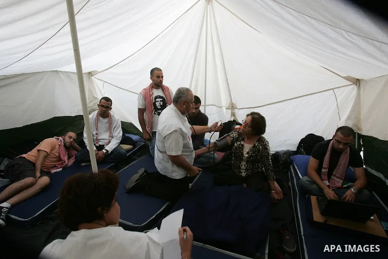 Palestinians take part in a protest in solidarity with their relatives Palestinian prisoners held in Israeli jails in a protest tent in front of the Red Cross' offices in east Jerusalem, on Oct,12, 2011.. Photo by Mahfou...
