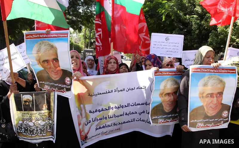 Women's Committees Federation take part in a protest in solidarity with Palestinian prisoners held in Israeli jails in a protest tent in front of the Red Cross' offices in east Jerusalem, on Oct, 13, 2011. Thousands of P...