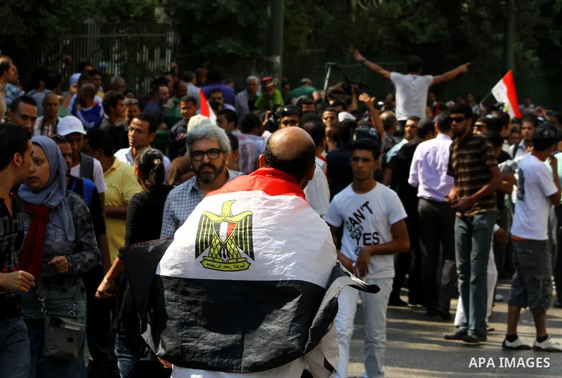 Egyptian protesters shout slogans during a demonstration outside a mosque in Cairo in support of national unity that led to a clash between pro- and anti-military supporters on October 14, 2011. The military has run Egyp...