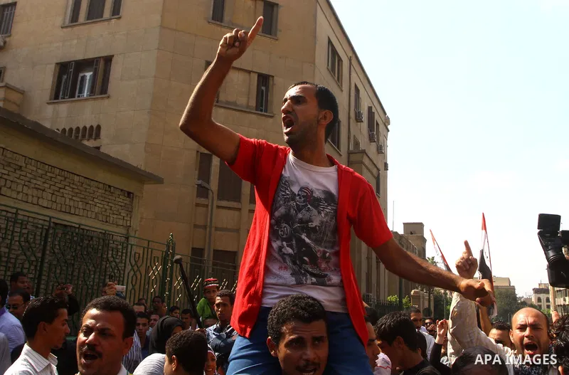 Egyptian protesters shout slogans during a demonstration outside a mosque in Cairo in support of national unity that led to a clash between pro- and anti-military supporters on October 14, 2011. The military has run Egyp...