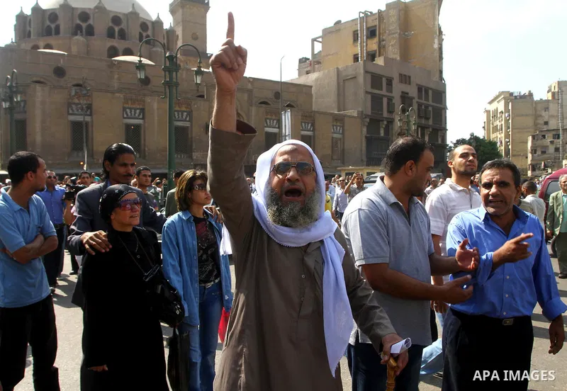 Egyptian protesters shout slogans during a demonstration outside a mosque in Cairo in support of national unity that led to a clash between pro- and anti-military supporters on October 14, 2011. The military has run Egyp...