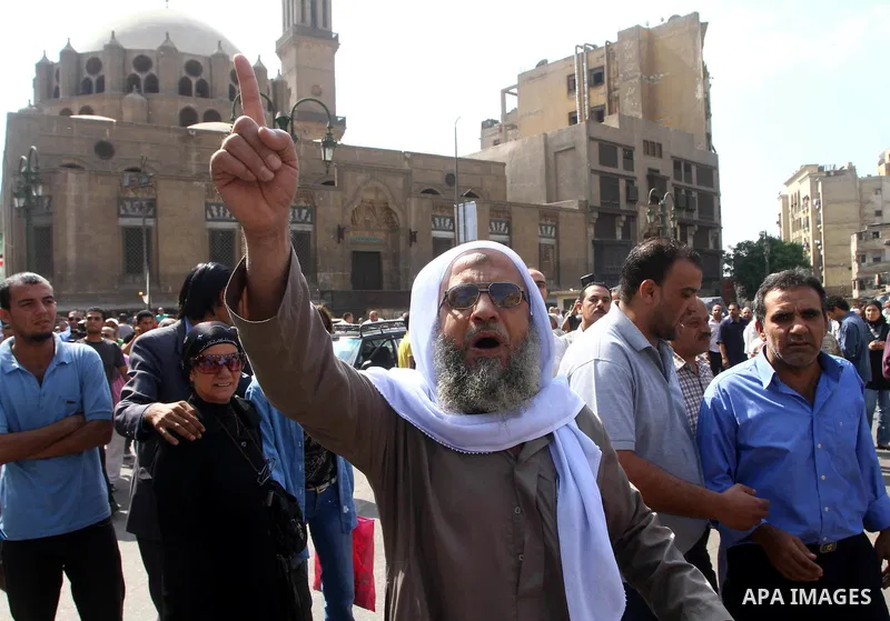 Egyptian protesters shout slogans during a demonstration outside a mosque in Cairo in support of national unity that led to a clash between pro- and anti-military supporters on October 14, 2011. The military has run Egyp...