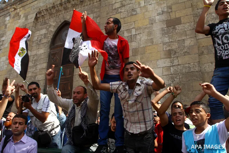 Egyptian protesters shout slogans during a demonstration outside a mosque in Cairo in support of national unity that led to a clash between pro- and anti-military supporters on October 14, 2011. The military has run Egyp...