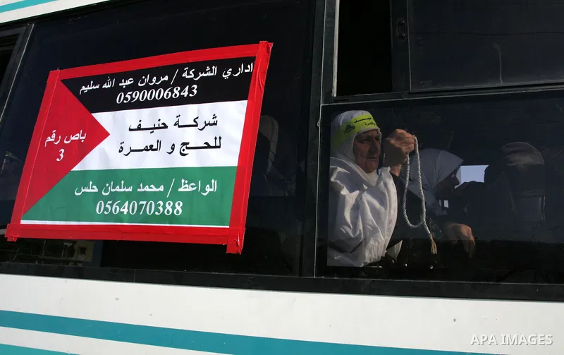 Palestinian pilgrims arrive at the Rafah border crossing between the Gaza Strip and Egypt on their way to the annual hajj or pilgrimage in the Saudi Muslim holy city of Mecca, on October 14, 2011. Photo by Abed Rahim Kha...