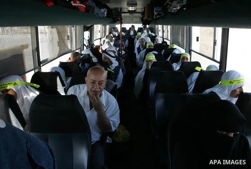 Palestinian pilgrims arrive at the Rafah border crossing between the Gaza Strip and Egypt on their way to the annual hajj or pilgrimage in the Saudi Muslim holy city of Mecca, on October 14, 2011. Photo by Abed Rahim Kha...