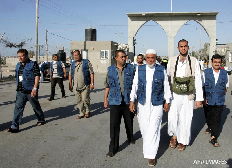 Palestinian pilgrims arrive at the Rafah border crossing between the Gaza Strip and Egypt on their way to the annual hajj or pilgrimage in the Saudi Muslim holy city of Mecca, on October 14, 2011. Photo by Abed Rahim Kha...