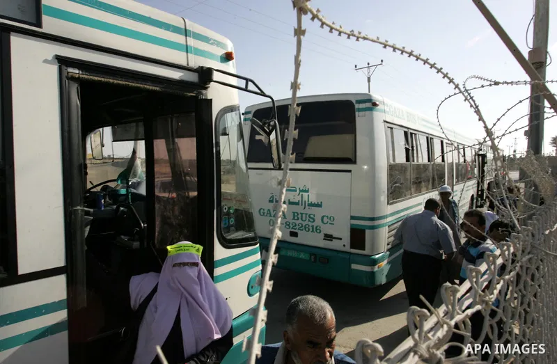 Palestinian pilgrims arrive at the Rafah border crossing between the Gaza Strip and Egypt on their way to the annual hajj or pilgrimage in the Saudi Muslim holy city of Mecca, on October 14, 2011. Photo by Abed Rahim Kha...