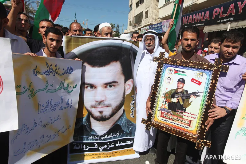 Palestinian relatives prisoners attend a protest calling for the release of their sons held in Israeli jails next the International Red Cross in Gaza City, Gaza Strip, on Oct. 15, 2011. Captive Israeli soldier Gilad Shal...
