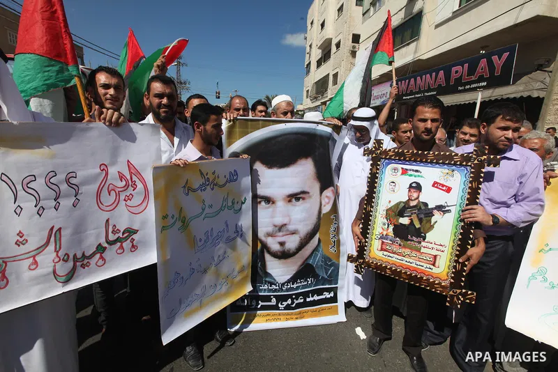 Palestinian relatives prisoners attend a protest calling for the release of their sons held in Israeli jails next the International Red Cross in Gaza City, Gaza Strip, on Oct. 15, 2011. Captive Israeli soldier Gilad Shal...