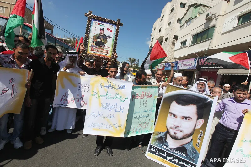 Palestinian relatives prisoners attend a protest calling for the release of their sons held in Israeli jails next the International Red Cross in Gaza City, Gaza Strip, on Oct. 15, 2011. Captive Israeli soldier Gilad Shal...