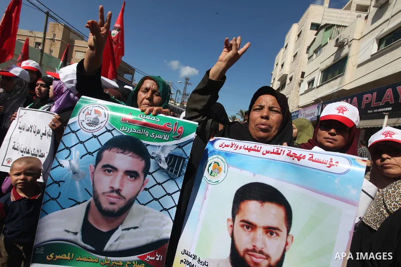 Palestinian relatives prisoners attend a protest calling for the release of their sons held in Israeli jails next the International Red Cross in Gaza City, Gaza Strip, on Oct. 15, 2011. Captive Israeli soldier Gilad Shal...