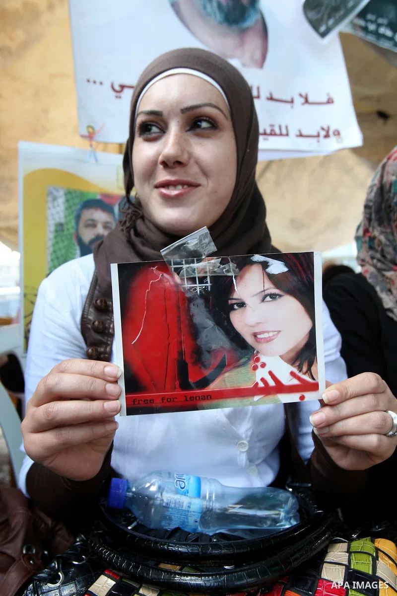 Palestinians celebrate the prisoner exchange deal between Hamas and Israel, in the West Bank city of Nablus Saturday, Oct.15, 2011. It is expected that Hamas will free the captured Israeli soldier Gilad Schalit in exchan...