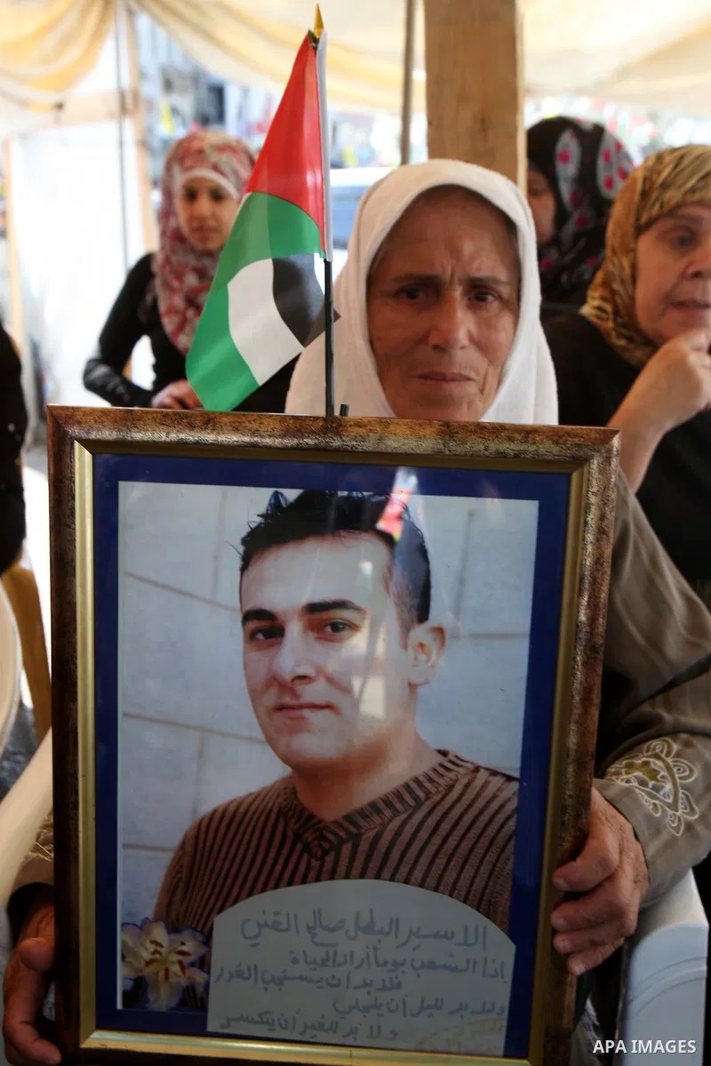 Palestinians celebrate the prisoner exchange deal between Hamas and Israel, in the West Bank city of Nablus Saturday, Oct.15, 2011. It is expected that Hamas will free the captured Israeli soldier Gilad Schalit in exchan...