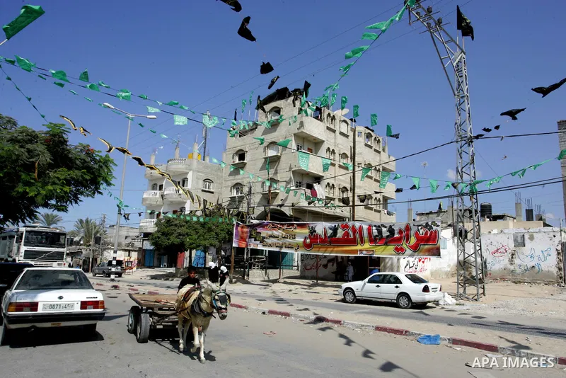 The families of Palestinian prisoners loyal to the leader of the Palestinian Fatah party led by Mahmoud Abbas, Hamas flags decorate their homes in Rafah town in the southern Gaza Strip on October 16, 2011. Israel on Sund...