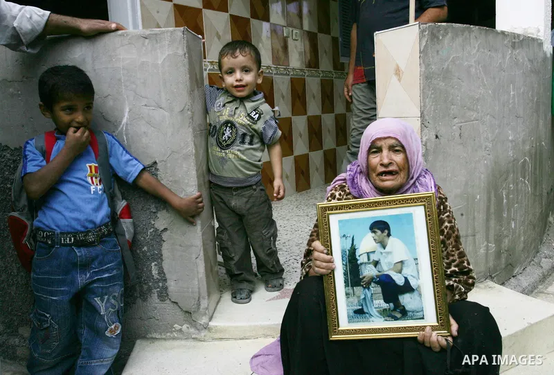 The families of Palestinian prisoners loyal to the leader of the Palestinian Fatah party led by Mahmoud Abbas, Hamas flags decorate their homes in Rafah town in the southern Gaza Strip on October 16, 2011. Israel on Sund...