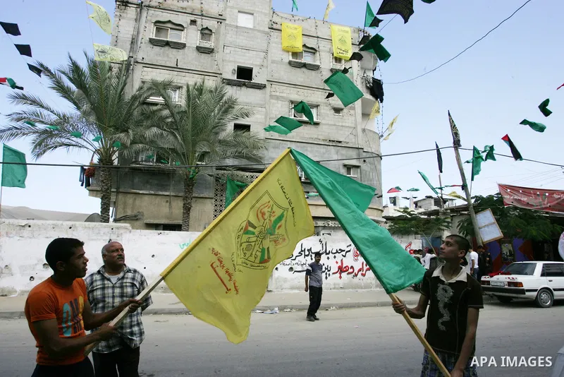 The families of Palestinian prisoners loyal to the leader of the Palestinian Fatah party led by Mahmoud Abbas, Hamas flags decorate their homes in Rafah town in the southern Gaza Strip on October 16, 2011. Israel on Sund...