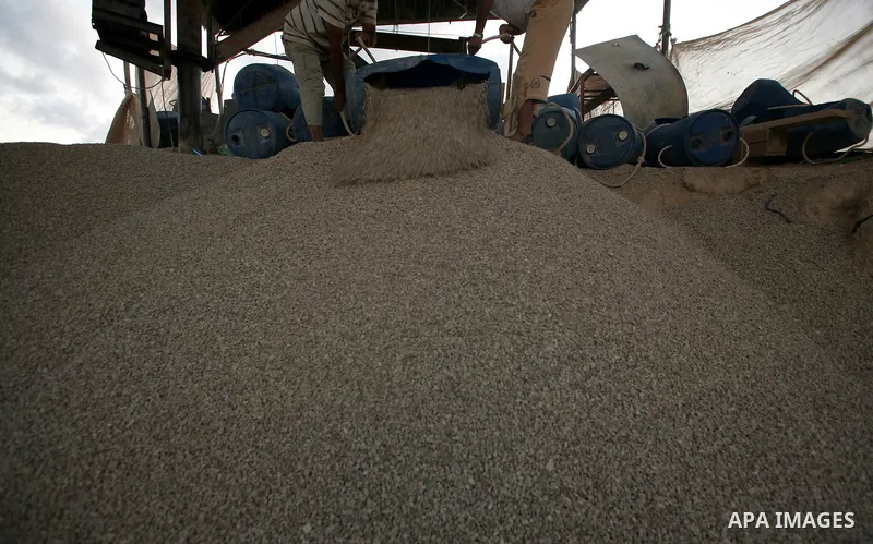Palestinian men smuggle gravels into the Gaza Strip through a tunnel under the Egypt-Gaza border in Rafah on Oct. 16, 2011. Israel released a list of 477 Palestinian prisoners to be released next week as part of the deal...