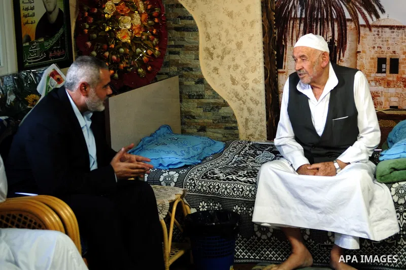Palestinian Prime Minister in Gaza Strip, Ismail Haniyeh visits with his ministers and legislators one of Hamas founders, Abed el-Fatah Doukhan in Gaza City, Sunday, Oct. 16, 2011. The relatives of Israelis killed in Pal...