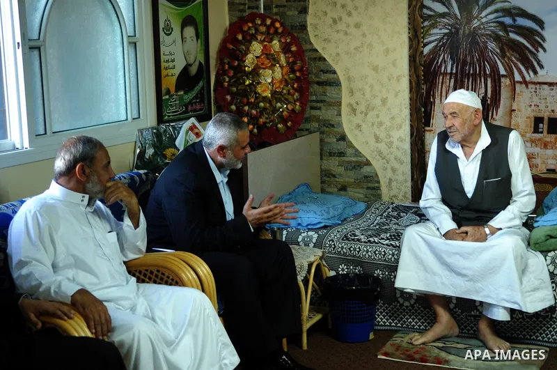 Palestinian Prime Minister in Gaza Strip, Ismail Haniyeh visits with his ministers and legislators one of Hamas founders, Abed el-Fatah Doukhan in Gaza City, Sunday, Oct. 16, 2011. The relatives of Israelis killed in Pal...