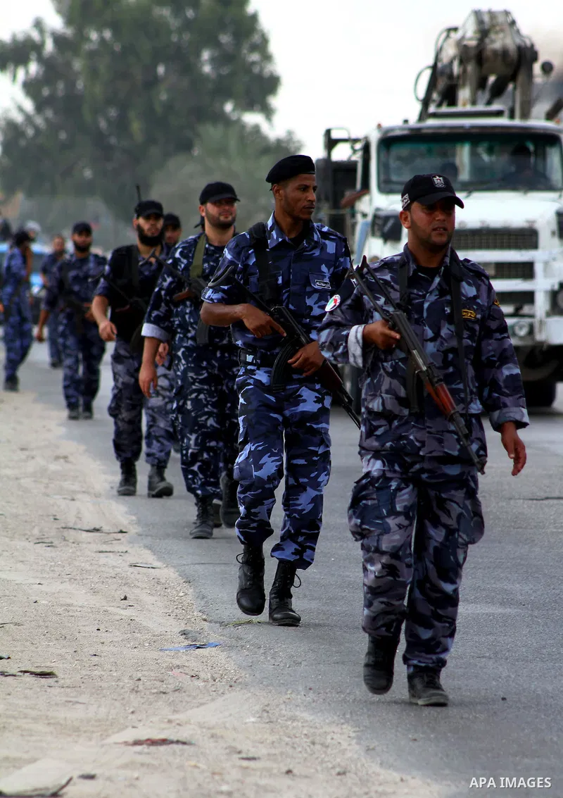 Palestinian Hamas policemen patrol in the central Gaza Strip October 17, 2011, as they patrol during preparations for the release of prisoners in a swap that is expected to take place on Tuesday. Hamas prepared a heroes'...