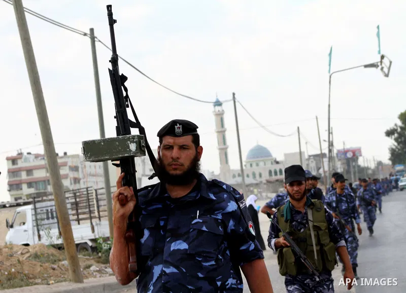Palestinian Hamas policemen patrol in the central Gaza Strip October 17, 2011, as they patrol during preparations for the release of prisoners in a swap that is expected to take place on Tuesday. Hamas prepared a heroes'...